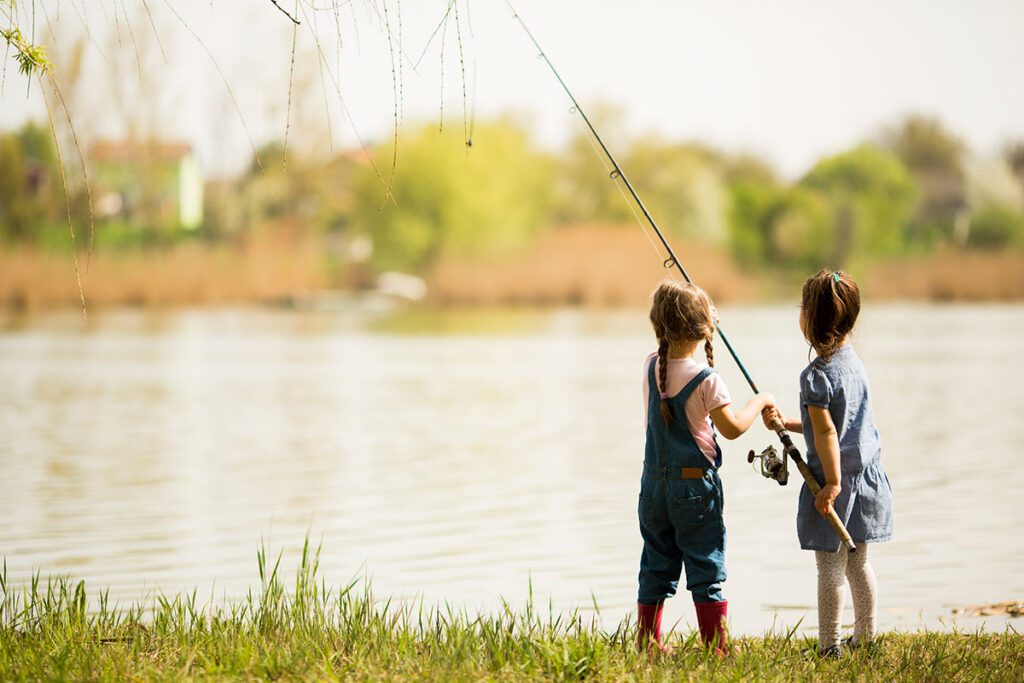 Two young girls fishing.